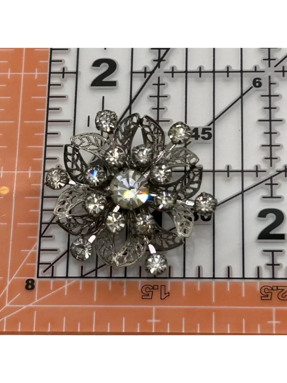 Vintage Silver Tone Rhinestone Brooch Pin Clear Crystal Floral Filigree Mid Cent